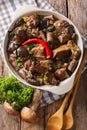 Stew beef with wild forest mushrooms and chili close-up. vertical top view Royalty Free Stock Photo