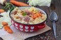 Stew cabbage with pork in red pot Royalty Free Stock Photo