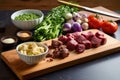 stew ingredients prepped on a board, knife nearby