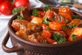 Stew in tomato sauce with vegetables close up in a pot Royalty Free Stock Photo