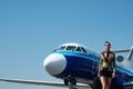 Stewardess in blue uniform. Traveling and jet plane flying concept. Beautiful charming stewardess dressed in official Royalty Free Stock Photo