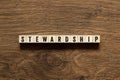 Stewardship - word concept on building blocks, text