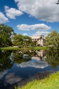 Stewart Park, a view of the willow trees and old stone house surrounded by trees, reflected on pond in summer. Perth Royalty Free Stock Photo