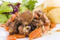 Stewed beef steak with potatoes and salad Royalty Free Stock Photo