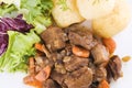 Stewed beef steak with potatoes and salad