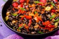 Stewed black beans with sweet peppers and tomatoes with spicy sauce