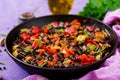 Stewed black beans with sweet peppers and tomatoes with spicy sauce