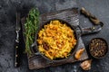 Stewed cabbage Bigos with mushrooms and sausages. Black background. Top view Royalty Free Stock Photo