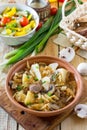 Stewed cabbage with mushrooms, mushrooms and tomato sauce with fresh vegetables Royalty Free Stock Photo