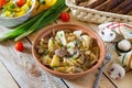 Stewed cabbage with mushrooms, mushrooms and tomato sauce with fresh vegetables Royalty Free Stock Photo