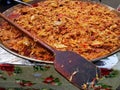 Stewed cabbage with sausage on a big tray.