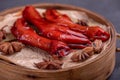 Stewed chicken feet are in the container in the dark background Royalty Free Stock Photo