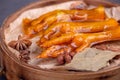 Stewed chicken feet are in the container in the dark background Royalty Free Stock Photo