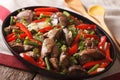 Stewed Chicken liver with onion and pepper close-up. horizontal Royalty Free Stock Photo