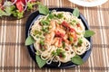 Stewed chicken with tomato sauce on a plate with spaghetti