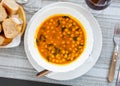 Stewed curried chickpeas with spinach on white plate