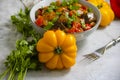 Stewed eggplant, tomato traditional autumn delicious , food preserve pepper on a concrete background