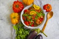 Stewed eggplant, tomato traditional delicious , food preserve pepper on a concrete background