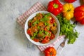 Stewed eggplant, tomato traditional , food preserve pepper on a concrete background