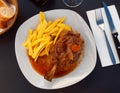 Stewed knuckle with potato served in a plate Royalty Free Stock Photo