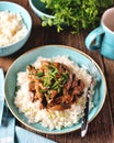 Stewed liver in a sauce with onion, carrot and parsley and boiled rice.