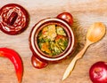 Stewed meat with potatoes in a clay pot, top view Royalty Free Stock Photo