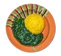 Stewed nettles with polenta in a rustic traditional clay bowl