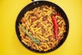 stewed pasta with meat is cooked in a frying pan Royalty Free Stock Photo