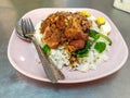 Stewed Pork Leg with Rice. Khao kha mu served with half spiced corned eggs, small pieces of pickled mustard greens Royalty Free Stock Photo