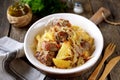 Stewed potatoes with cabbage, carrots, onions, tomato sauce and pork ribs. Royalty Free Stock Photo