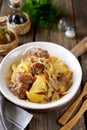 Stewed potatoes with cabbage, carrots, onions, tomato sauce and pork ribs. Royalty Free Stock Photo