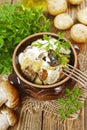 Stewed potatoes with mushrooms and sour cream Royalty Free Stock Photo