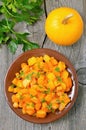 Stewed pumpkin on wooden table Royalty Free Stock Photo