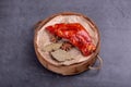 Stewed red pig\'s feet are in a bamboo container against a dark background Royalty Free Stock Photo