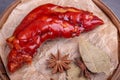 Stewed red pig\'s feet are in a bamboo container against a dark background Royalty Free Stock Photo