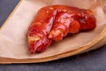 Stewed red pig's feet are in a bamboo container against a dark background Royalty Free Stock Photo