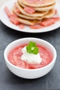 Stewed rhubarb with yogurt in a white dish