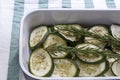 Stewed sliced zucchini with rosemary in bowl on the towel