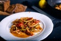 Stewed squid rings with tomato sauce and chilli Royalty Free Stock Photo