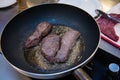 Stewed steaks on hot fraying pan