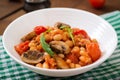 Stewed white beans with mushrooms and tomatoes with spicy sauce