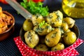 Stewed whole new baby potatoes with parsley sauce