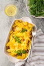 Stewed young potatoes with meat and cheese