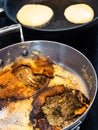 Stewpan with food burned while frying pancakes