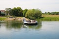 View on car, passenger and bicycle ferry boat to Baarlo over river Maas Royalty Free Stock Photo