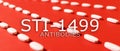 STI-1499 antibody concept. white pills scattered on a red background. Royalty Free Stock Photo