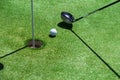 Stick with a ball on an artificial golf Royalty Free Stock Photo