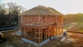 A stick built house under construction New build with wooden and beam framework Royalty Free Stock Photo