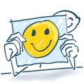 Stick figure behind a note paper and a happy face on it