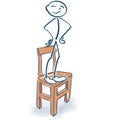 Stick figure stands proudly on the chair Royalty Free Stock Photo